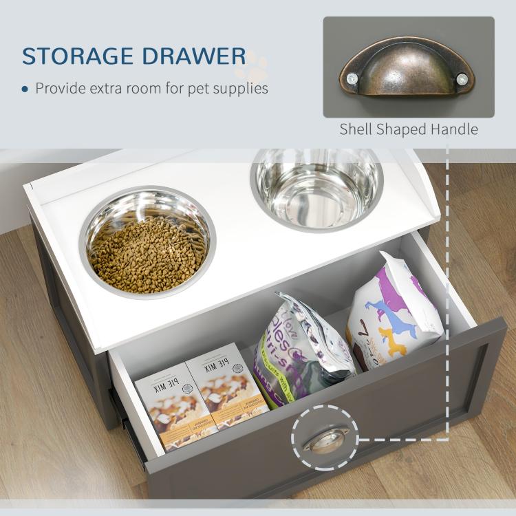 Gray pet feeding station with open storage drawer holding pet supplies and two bowls