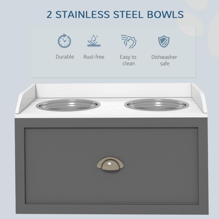Gray pet feeding station with two stainless steel bowls and front storage drawer