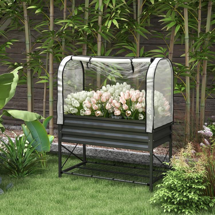 Black metal raised garden bed planter with clear protective cover outdoors