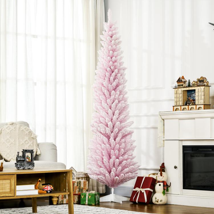 Pink snow-flocked pencil Christmas tree standing upright with dense layered branches