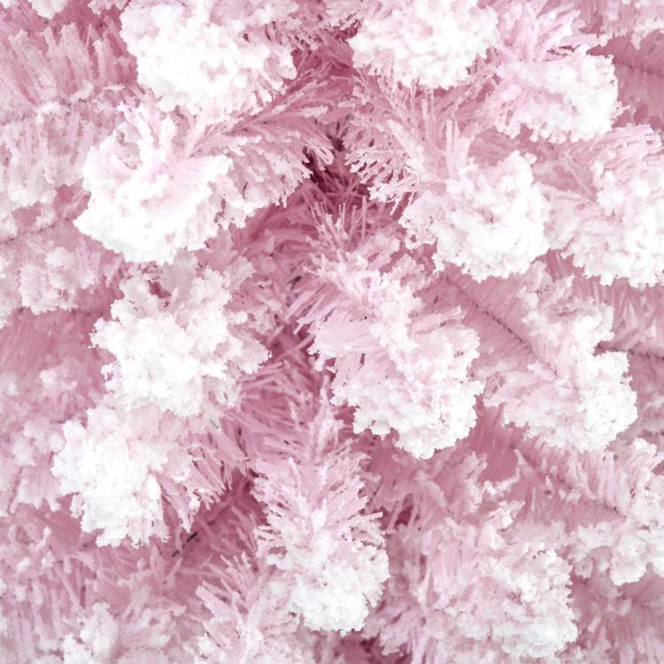 Close-up of pink snow-flocked artificial tree branches with white coating
