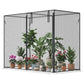 Black mesh crop cage with upright frame and potted flowers and herbs inside