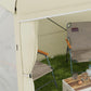 Cream pop-up canopy tent with open side and attached side curtain panel