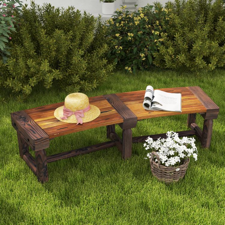 Wooden outdoor tree bench with dark brown slatted seat in a patio garden setting