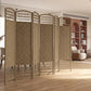 Natural 6-panel folding privacy screen partition with woven lattice panels in office room