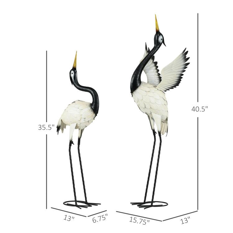 Set of 2 standing heron statues with height measurements on metal stands