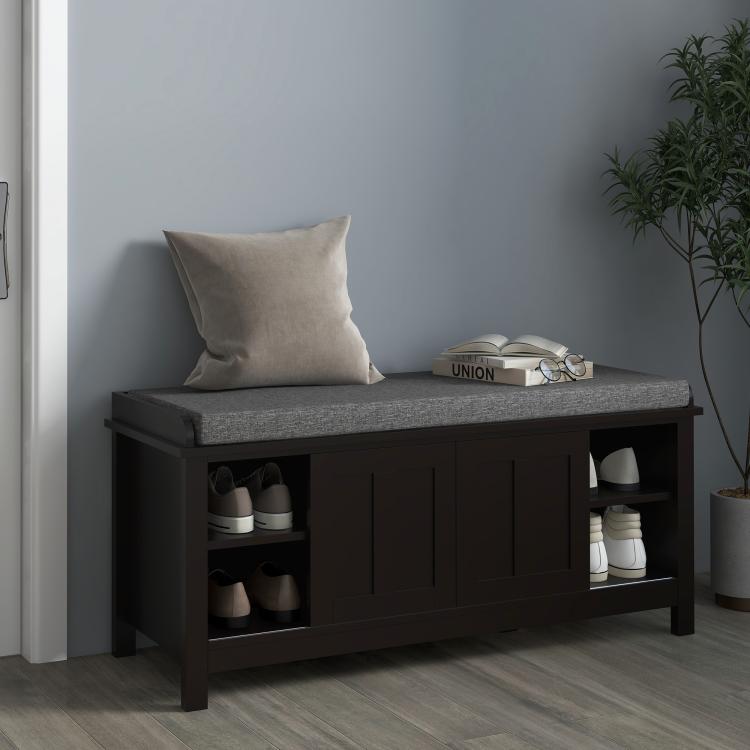 Black shoe storage bench with gray padded cushion and visible shoe compartments