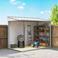 White metal outdoor storage shed, open double doors with interior shelving