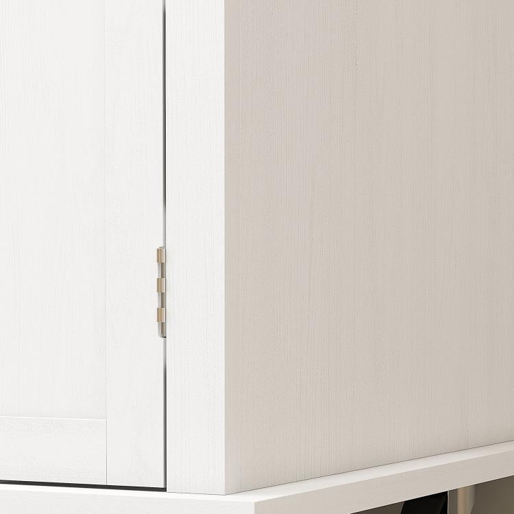 Close-up of metal cabinet hinge on distressed white kitchen island cart