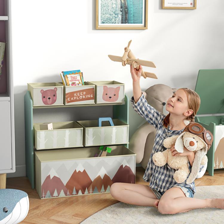 Green toy organizer with open bins for kids, featuring bear and tree-pattern storage