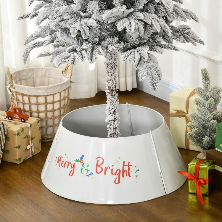 Cream white tree skirt collar on floor with “Merry & Bright” front print