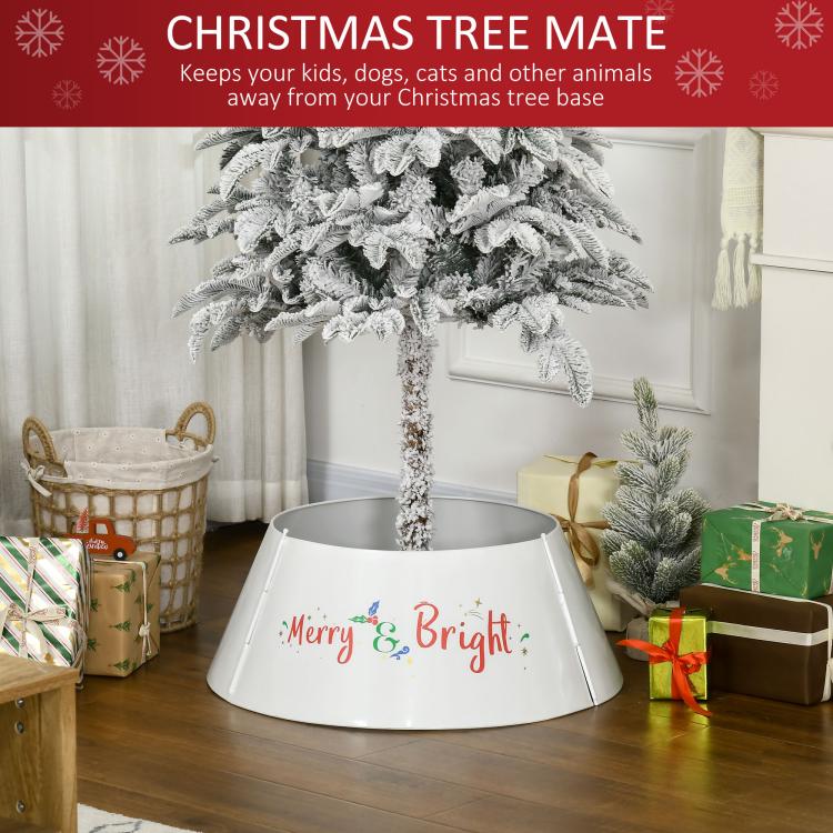 Cream white metal Christmas tree skirt with “Merry & Bright” front, on floor
