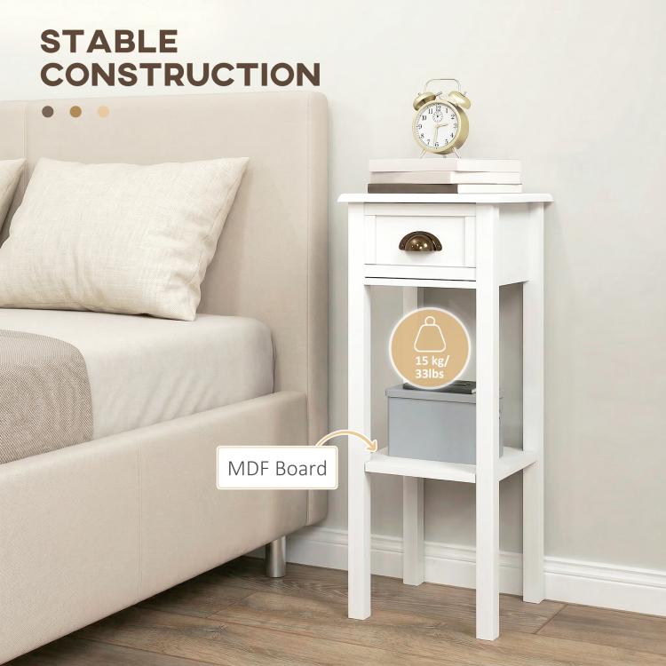 White side table with drawer and open shelf next to a couch, showing sturdy construction.