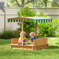 Wooden kids sandbox with striped canopy and bench seats, children playing outdoors