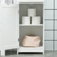 White narrow bathroom storage cabinet with open shelf and two recessed doors