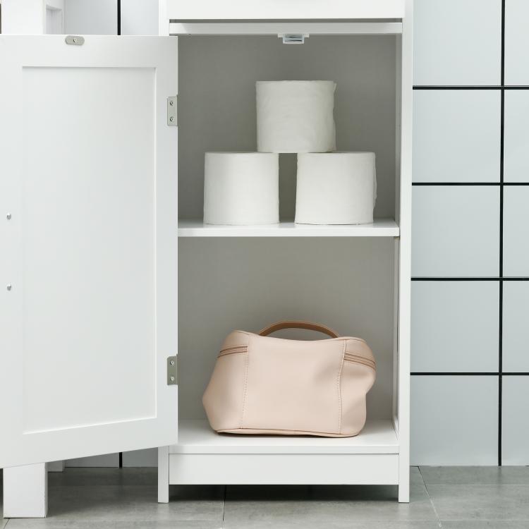 White narrow bathroom storage cabinet with open shelf and two recessed doors