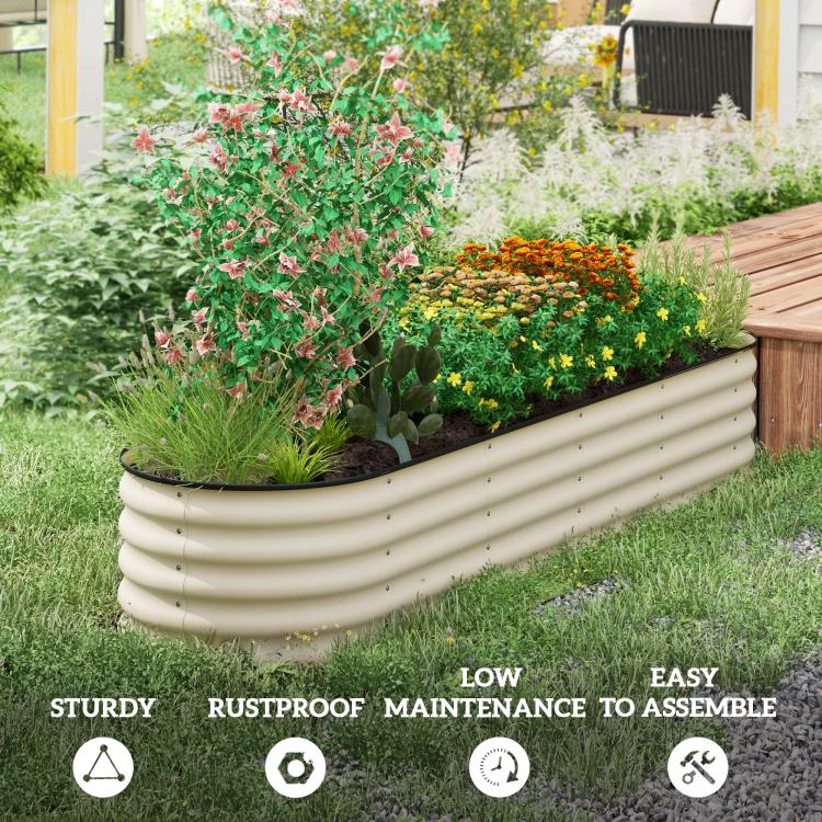 Cream raised garden bed with ridged sides, planted with flowers in a yard