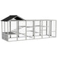 Gray outdoor chicken run enclosure with black roof and wire mesh walls, showing interior