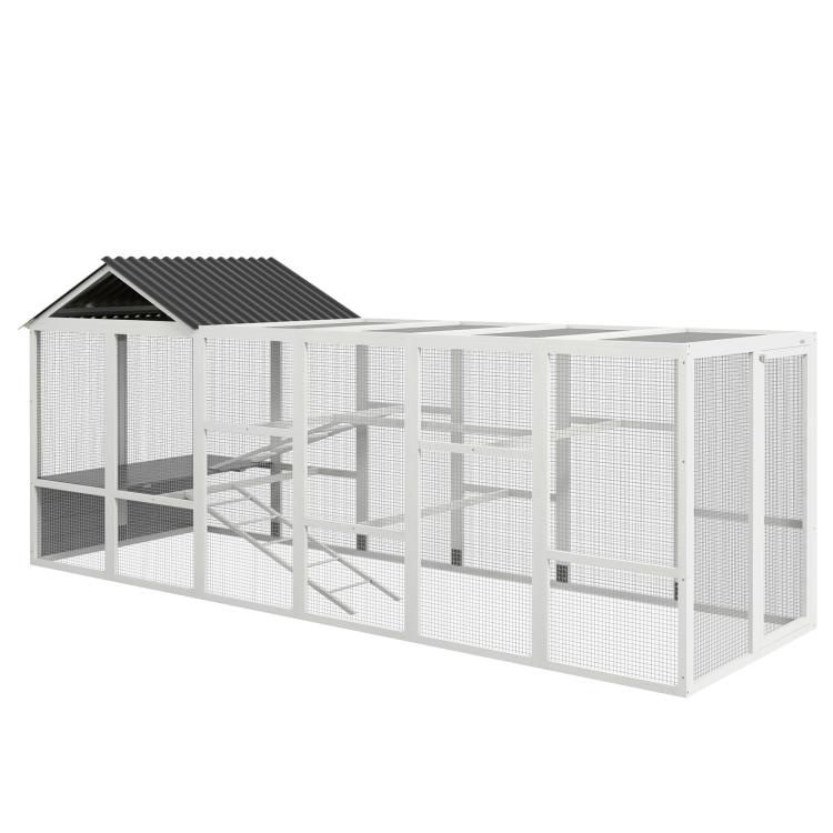 Gray wooden chicken coop run with gable roof, wire mesh sides, and ramp