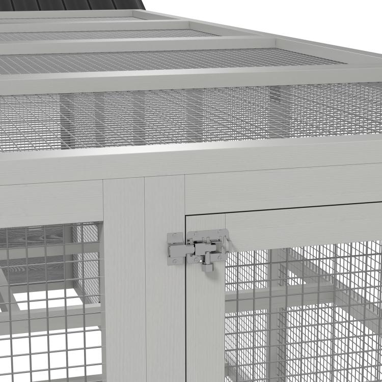 Close-up of gray chicken run roof and side frame with wire mesh panels