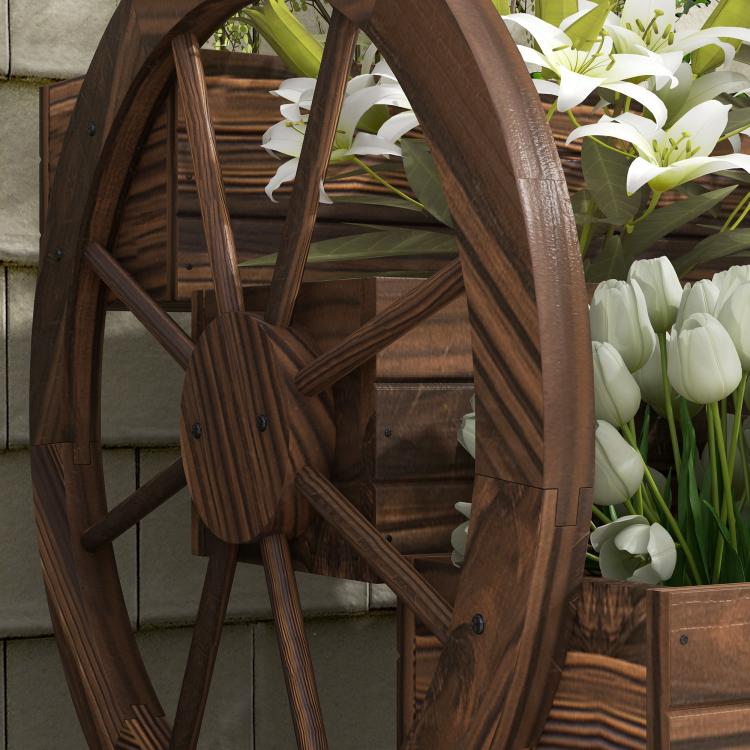 Wooden wagon planter box with arched frame, large wheels, and dark wood interior