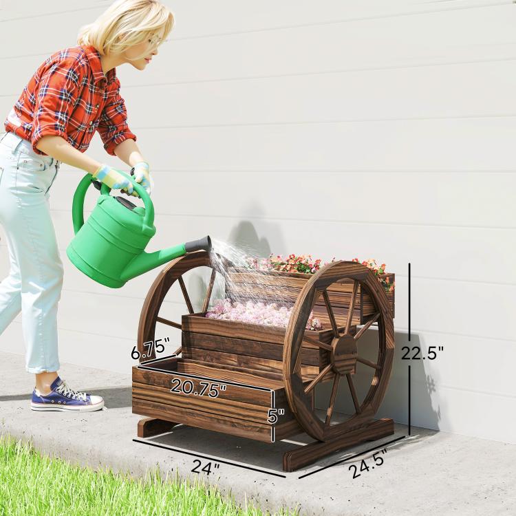 Wooden wagon-style planter box with wheels, shown on grass with flowers inside