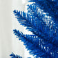 Blue decorated pencil Christmas tree branch tips close-up