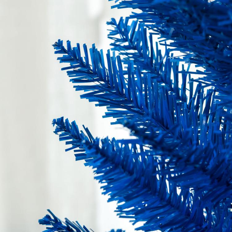 Blue decorated pencil Christmas tree branch tips close-up
