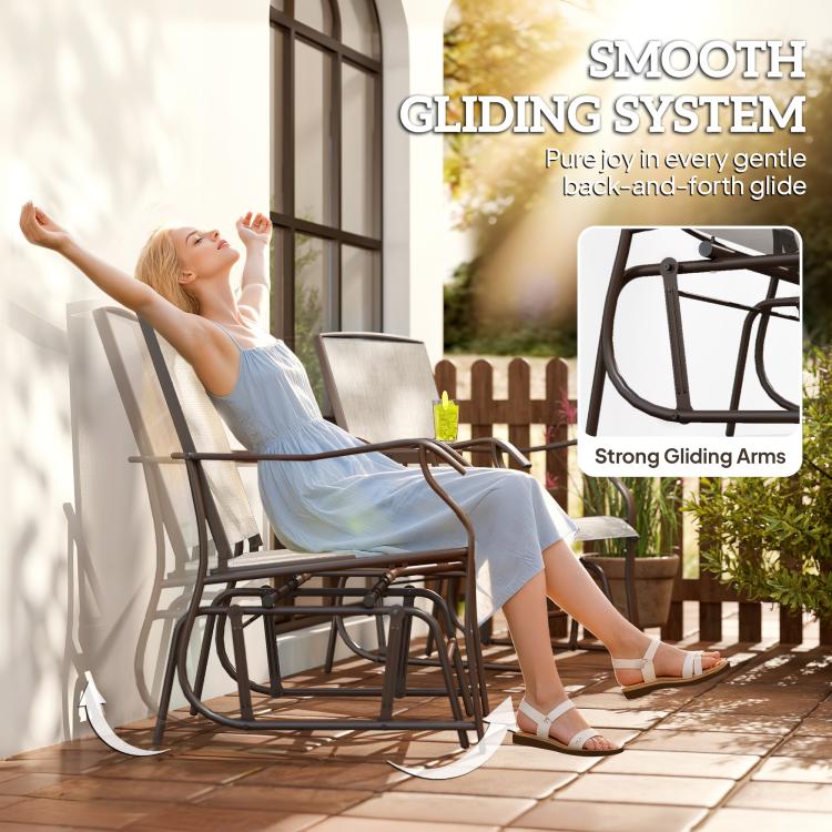 Outdoor glider rocking chair with light beige sling back and seat, dark steel frame