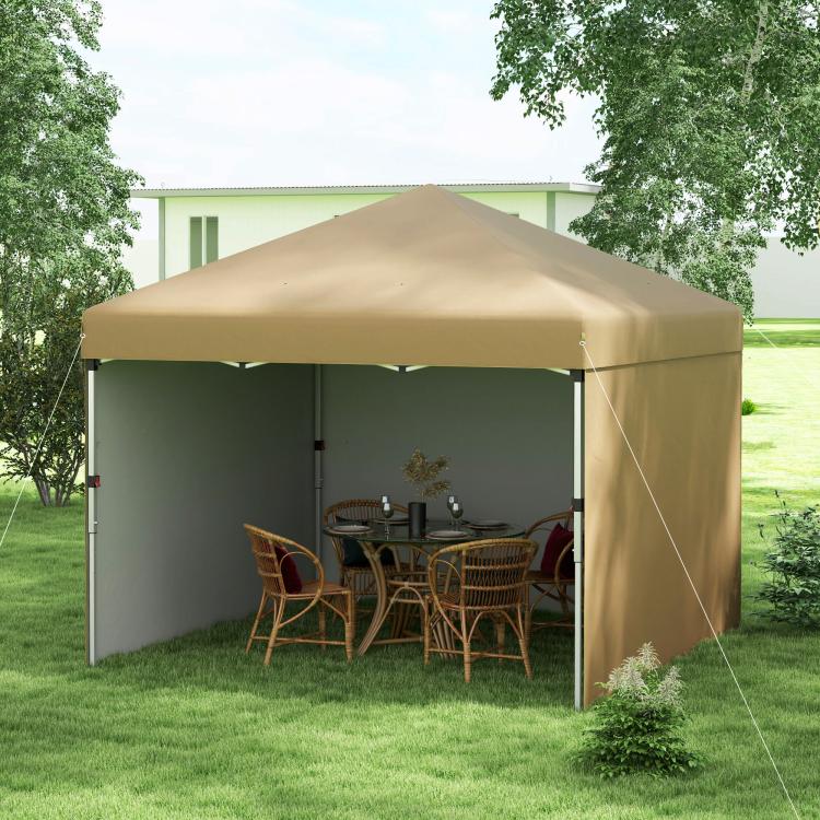 Beige pop-up canopy tent with sidewalls set up on a lawn