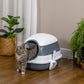 Covered cat litter box with dome lid, white and gray, cat at front entrance
