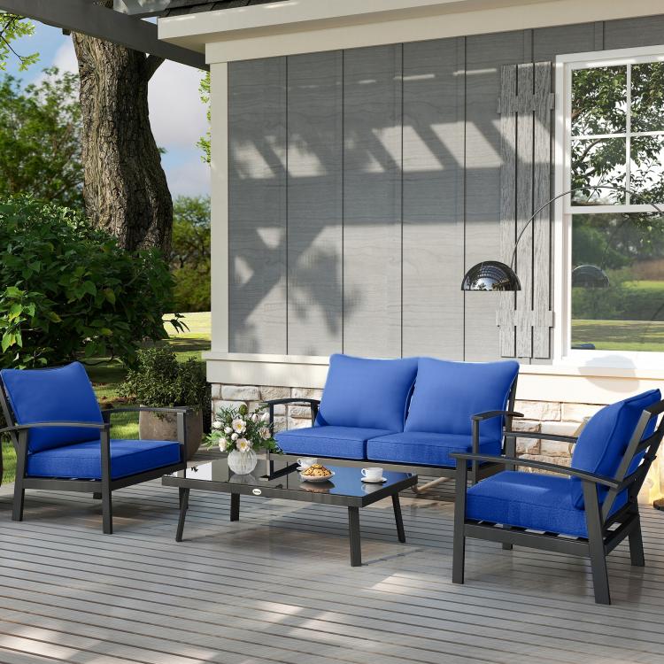 Navy blue seat and back cushions on patio chairs around a table