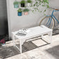 White slatted wooden garden bench with curved seat front, styled outdoors with decor
