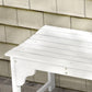 Close-up of white slatted wooden bench seat and curved front legs