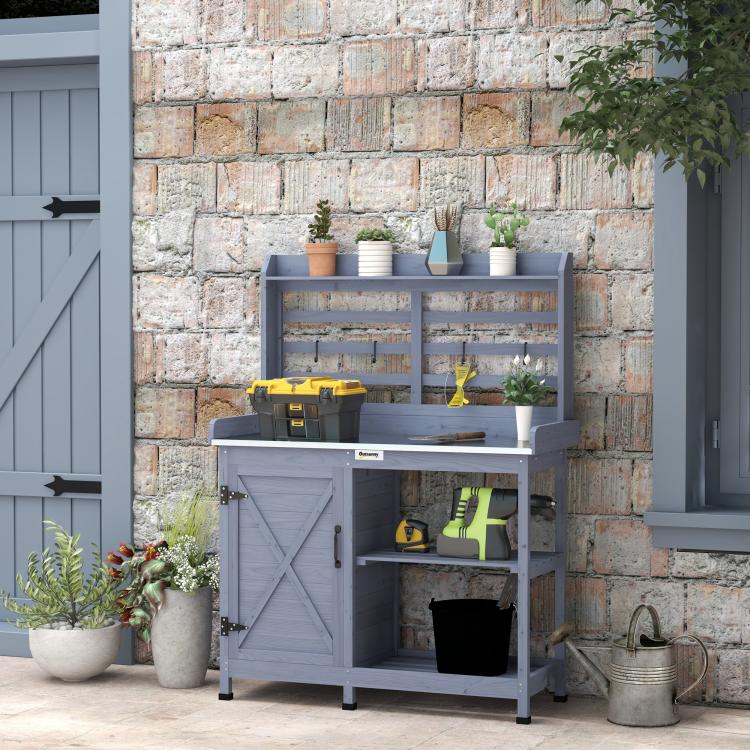 Gray potting bench with slatted back, open cabinet, and double door storage