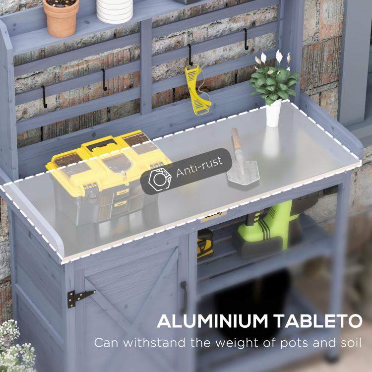 Gray potting bench with open aluminum tabletop, storage cabinet, and tool hooks