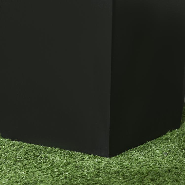 Square outdoor planter pot, black, with drainage holes (partial view at corner)