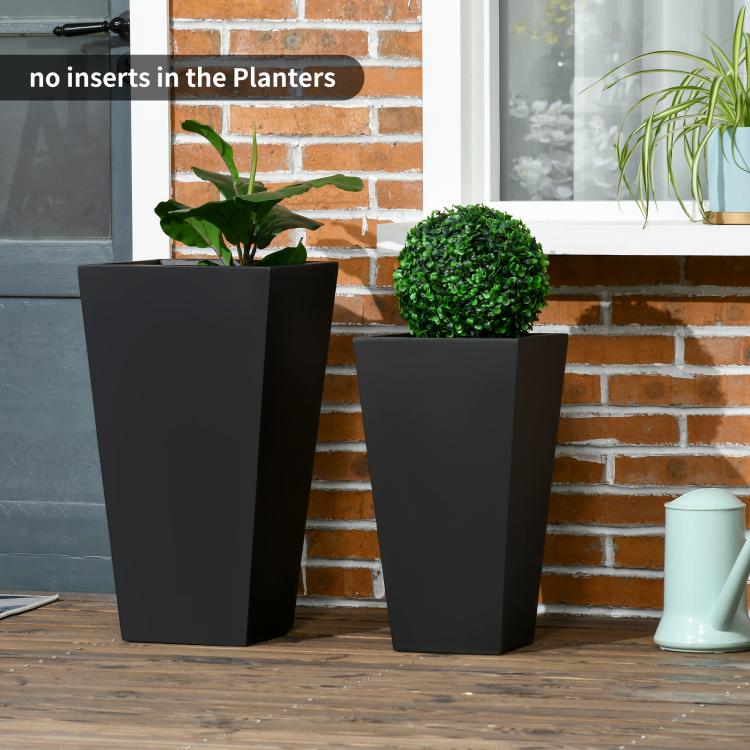 Two black tall square planters with small potted greenery