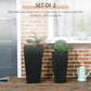 Two black tall square planters with potted greenery