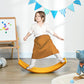 Orange balance board used by a child standing and wobbling during play