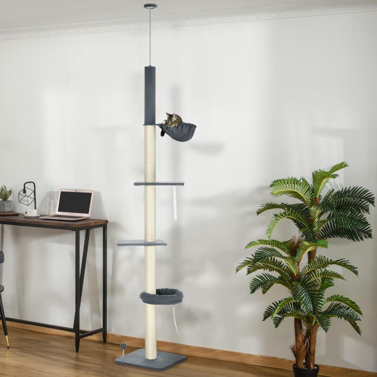 Floor-to-ceiling cat tree with carpeted steps, hammock, and raised cozy platform base