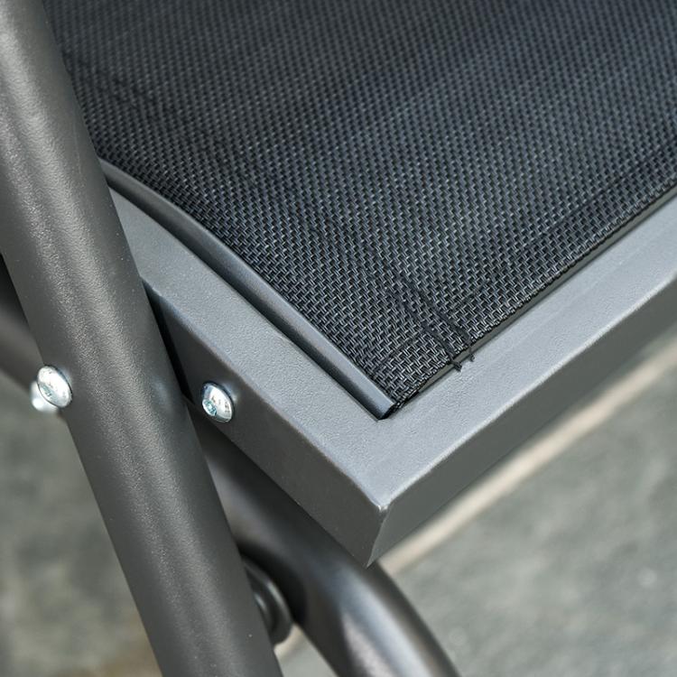 Corner close-up of gray mesh seat on black frame with secure stitching and bolts
