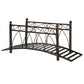 Bronze metal arch garden footbridge with decorative scroll railings and corner spheres