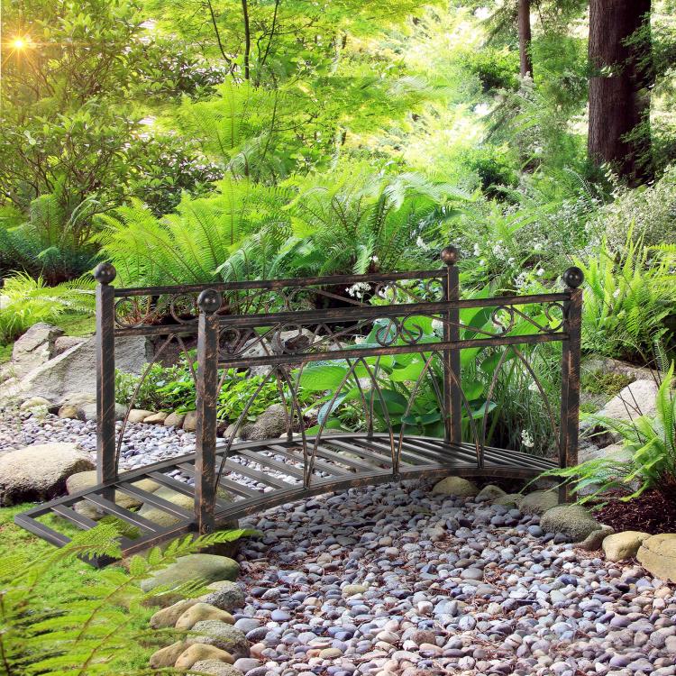 Bronze metal zen garden bridge with side safety rails and arched decorative panels