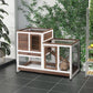 Indoor wooden rabbit hutch with wire doors, ramp, and elevated top platform