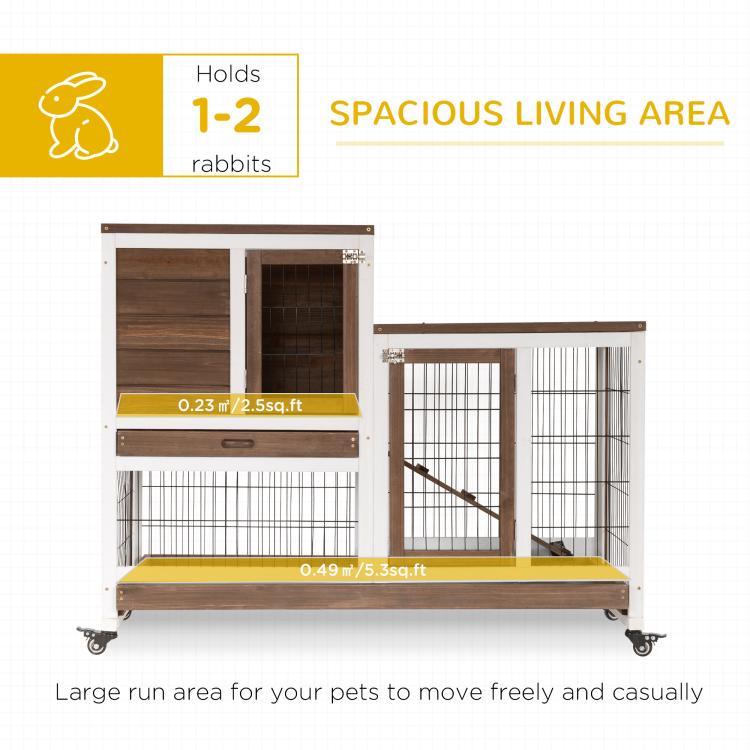 Wooden rabbit hutch on wheels with wire enclosures and built-in ramp