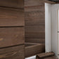 Close-up of wooden interior wall panel and ramp step in a rabbit hutch