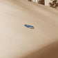 Khaki canopy fabric close-up with oval metal-reinforced patch