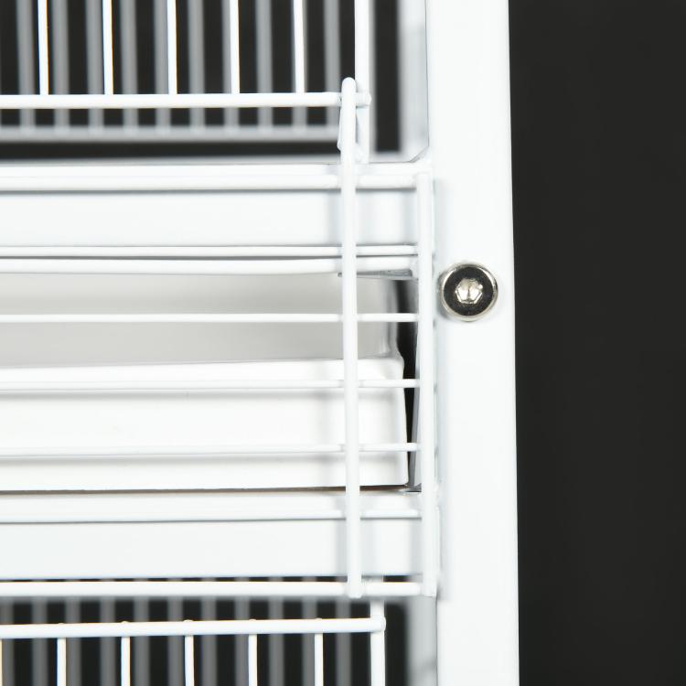 White metal bird cage door latch and wire bars at the front opening
