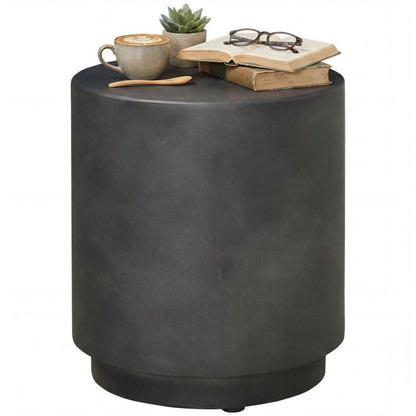 Round dark gray accent side table with concrete-look finish and sturdy cylindrical shape